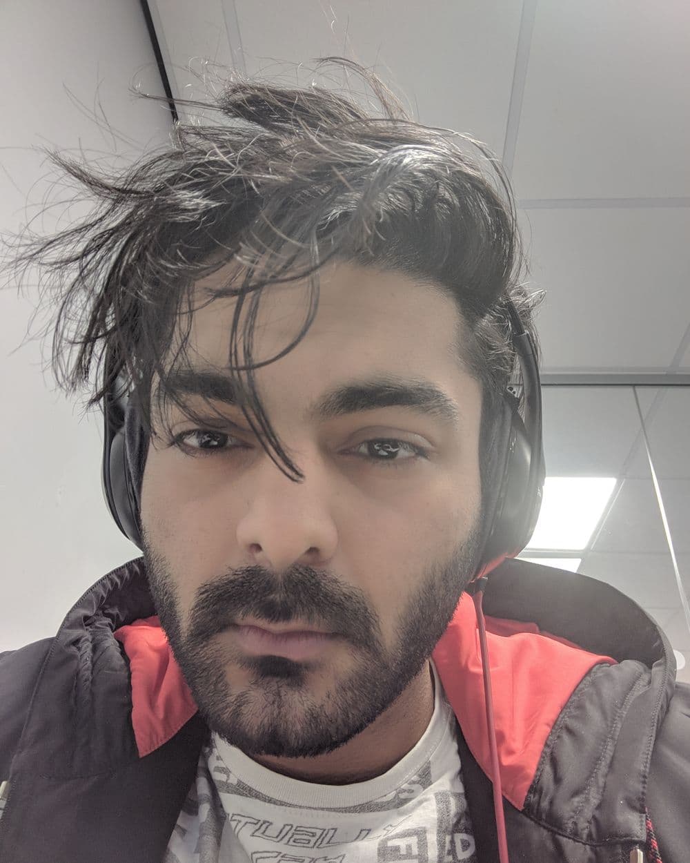 Sahil in headphones, hair everywhere